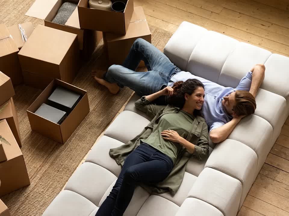 Couple relaxing at home after a successful closing